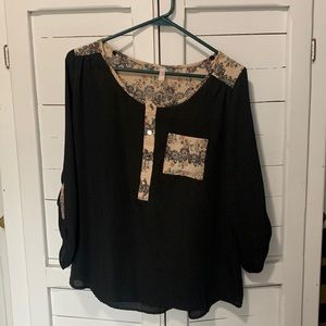 Black blouse with button detail and floral designs. Size small